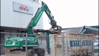 lovely painted Caterpillar M322D excavator demolishing old bus stop [upl. by Ellan783]