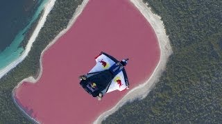 Wingsuit flying over a pink lake in Australia [upl. by Ainitsirc]