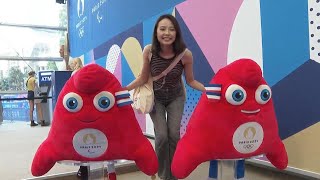 Demand for Olympic mascot souvenirs as throngs of tourists queue up at Paris 2024 merchandise store [upl. by Azeria]