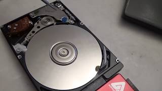 Take a look inside a hard drive while its running [upl. by Banquer]