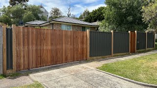 Colorbond fence with exposed posts and vertical merbau cladded gates [upl. by Hilleary11]