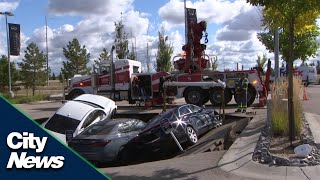 Sudden sinkhole shocks Edmonton car dealership [upl. by Nerb]