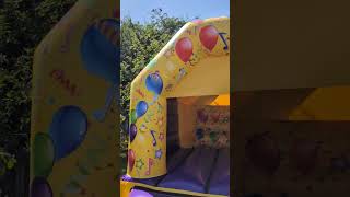 yellow and purple neutral themed party time bouncy castle for hire in Stockport Tameside Oldham [upl. by Pellikka]