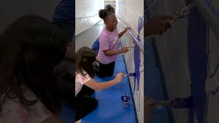 Student artists help paint school mural at Victory Elementary School [upl. by Yelserp630]