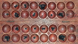 How to play omwesoigisoro African mancala game [upl. by Riebling]