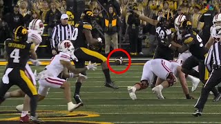 Iowa player kicks ball to himself on wild INT vs Wisconsin [upl. by Atilegna]