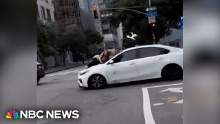 Video shows LA woman clinging to car after alleged dognapping [upl. by Oivalf807]