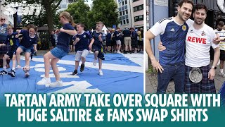 Tartan Army play football on huge Saltire and fans swap shirts in Cologne [upl. by Karry]