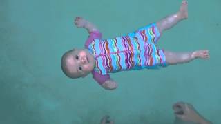 Baby swimming  floating unassisted at 5 months old [upl. by Sykleb211]