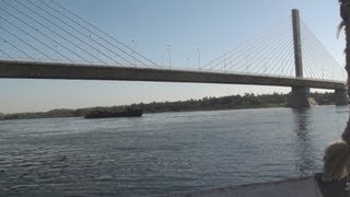 Negotiating a Felucca under the Aswan Bridge on the Nile River  Egypt [upl. by Lenno953]