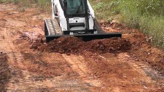 Quick Attach® Versa Blade 6 Way Skid Steer Dozer Blade for skid steer in action [upl. by Olney]