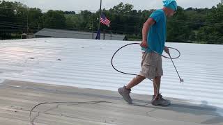 Spraying Uniflex Elastomeric Roof Coating short version [upl. by Atiuqin108]