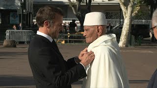 À Bastia Macron décore le dernier tirailleur marocain encore en vie  AFP Images [upl. by Miarfe]