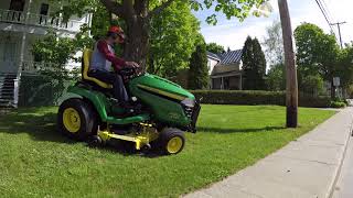 Brand new John Deere X584 mowing a residential lawn 05302018 [upl. by Sigrid53]