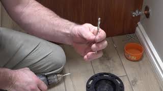 How To Install A Toilet Flange On A Tile Floor [upl. by Korey53]