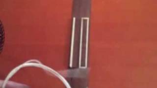 How to put strings on a classical guitar  a close up [upl. by Adelina]