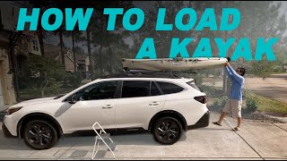 How to Load and Secure a Kayak to the Roof Rack  with Yakima ShowBoat [upl. by Sedicla415]