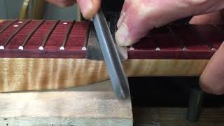 How To Spot Level Recrown Guitar Frets With A Triangle File [upl. by Anelam41]