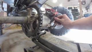 How to adjust the chain slack on a YFZ450 [upl. by Suoicerp725]