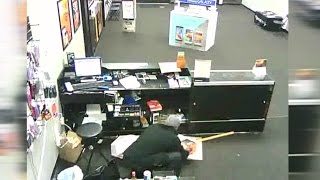 Caught on camera Boost Mobile store robbed at gunpoint [upl. by Obrien]