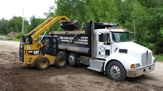 Caterpillar 262D Loading Tri Axle [upl. by Gonzalez250]