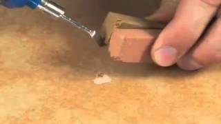 How to repair a hole or chip in a tile [upl. by Lirbaj]