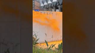 Demonstrators sprayed orange paint on the outer wall of the US Embassy in London to protest Trump [upl. by Aihsenyt390]