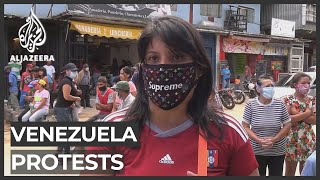 Venezuela protests Pandemic worsens economic crisis [upl. by Hgiellek]