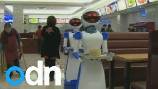 Restaurant in China hires robots as waiters [upl. by Wit91]