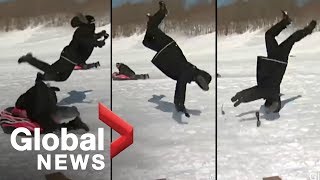 Reporter flipped by sled during news report OFFICIAL VIDEO [upl. by Nirred163]