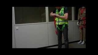 How to put on fall arrest harness vest with shock absorber [upl. by Naujid]