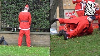 Londons SantaCon has drunk Bad Santas brawling and peeing in public  New York Post [upl. by Leirbaj]