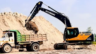 Hyundai Excavator Backhoe Machine Loading Sand into Dump Trucks [upl. by Atnoek]