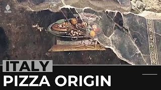 A slice of history Pompeii fresco shows ancestor of pizza [upl. by Elsa237]