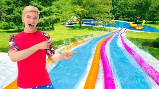 Worlds BIGGEST Inflatable Backyard Slip N Slide Sharer Family Ultimate Surprise Party Reveal [upl. by Nnylsor]