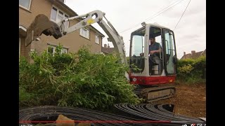 Digging out a driveway with a mini digger Takeuchi TB216 Excavator [upl. by Thorma]