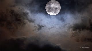 Full Moon at Perigee in a dramatic cloudy sky  4k Ultra HD [upl. by Ioyal812]