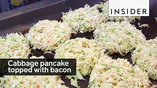 This cabbage pancake is topped with bacon [upl. by Peyter]