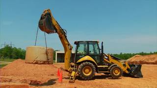 Cat® Backhoe Loaders  Side Shift Design vs Center Pivot Design [upl. by Eugenie649]