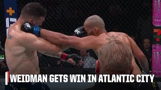 Chris Weidman gets win vs Bruno Silva after eye pokes in Round 3  ESPN MMA [upl. by Pomfrey]