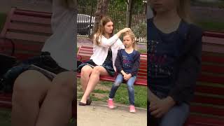 Kind woman helps little girl tie her hair shorts [upl. by Carlita792]