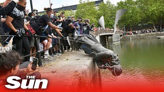 BLM protesters pull down statue of Edward Colston before throwing it into river in Bristol [upl. by Giah]