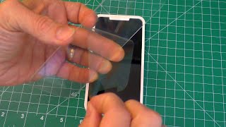 How to Install a Tempered Glass Screen Protector on your Phone W Guide Frame [upl. by Nymzaj145]