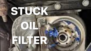 How To Remove A Stuck Mangled Oil Filter [upl. by Ylrebmic]