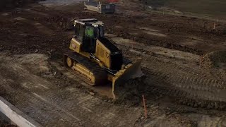 Cat® D4 dozer at Work  Finish Grading on a Building Site [upl. by Ringsmuth]