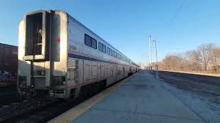 Amtrak 29 departing Elkhart station as a eastbound Cn manifest builds in Elkhart yard [upl. by Abercromby]