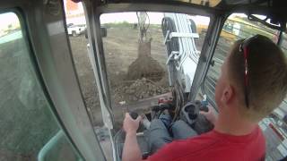 Takeuchi TB180 in cab view loading a tandem truck [upl. by Airamak]