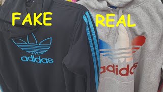 Real vs fake Adidas hoodie How to spot original Adidas hood jackets and sweatshirts [upl. by Nibram868]