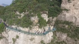 Breathtaking Ushaped Glass Skywalk Opens in Central China [upl. by Belicia304]