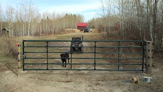 Electric Fencing Off My Offgrid Homestead Pt 1  Hanging a Steel Gate Driving Posts Cable Wire [upl. by Ahsinev546]